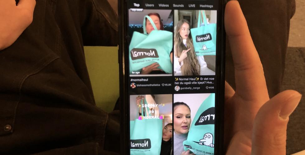Bilde av TikTok skrolling p&aring; mobil. 